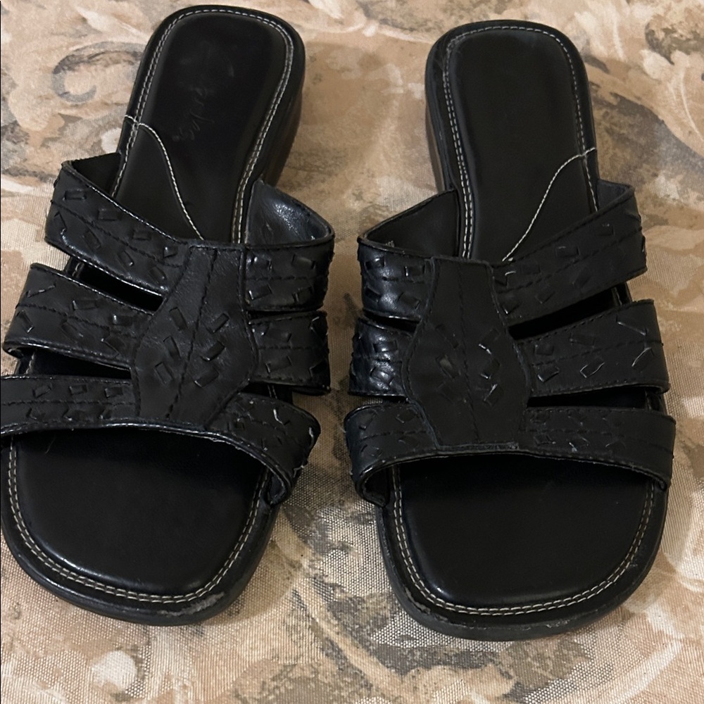 Clark’s Size 7 Black slip on sandals. VGUC.  Leather upper.